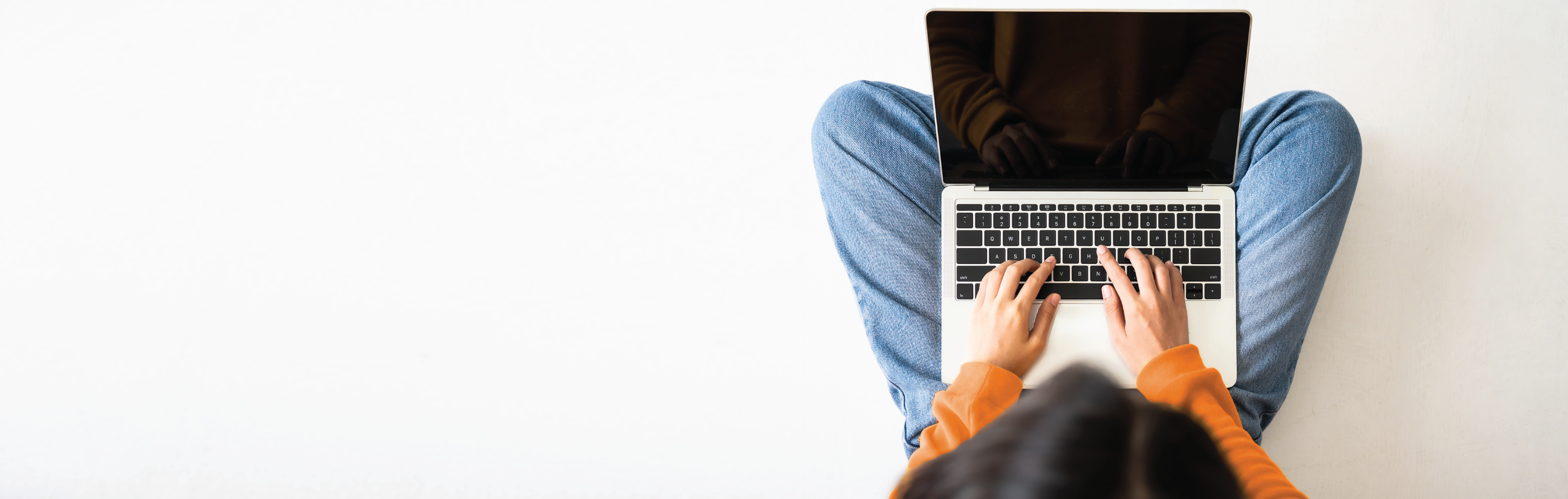 Person sitting with laptop computer