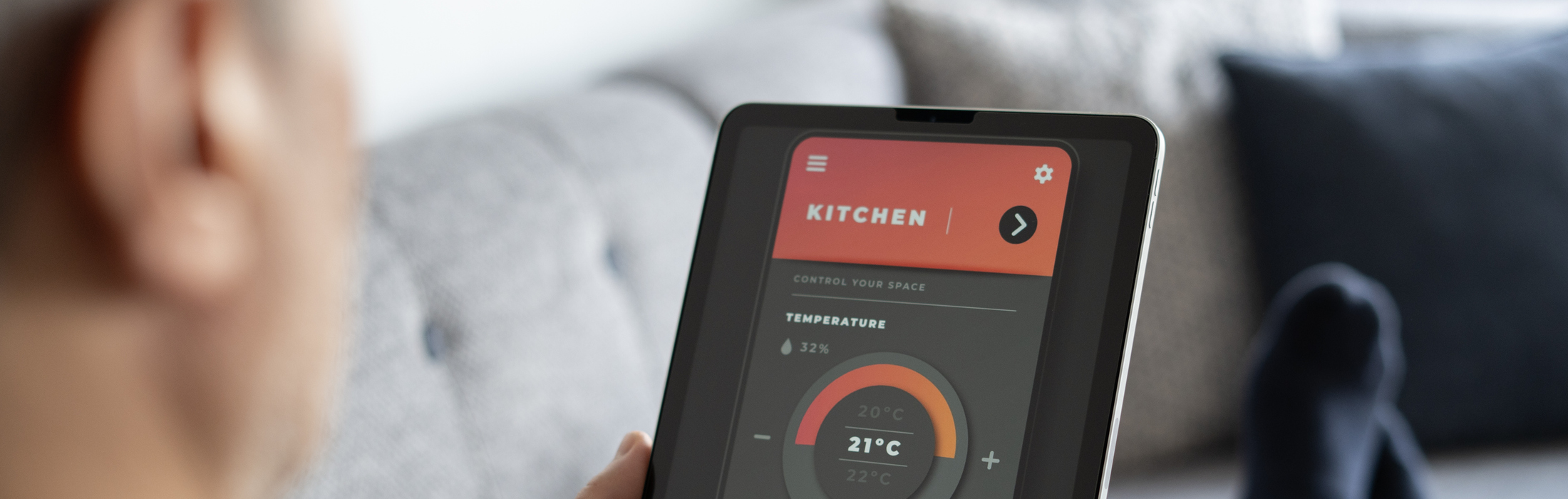 Adult man using smart heating system with digital tablet